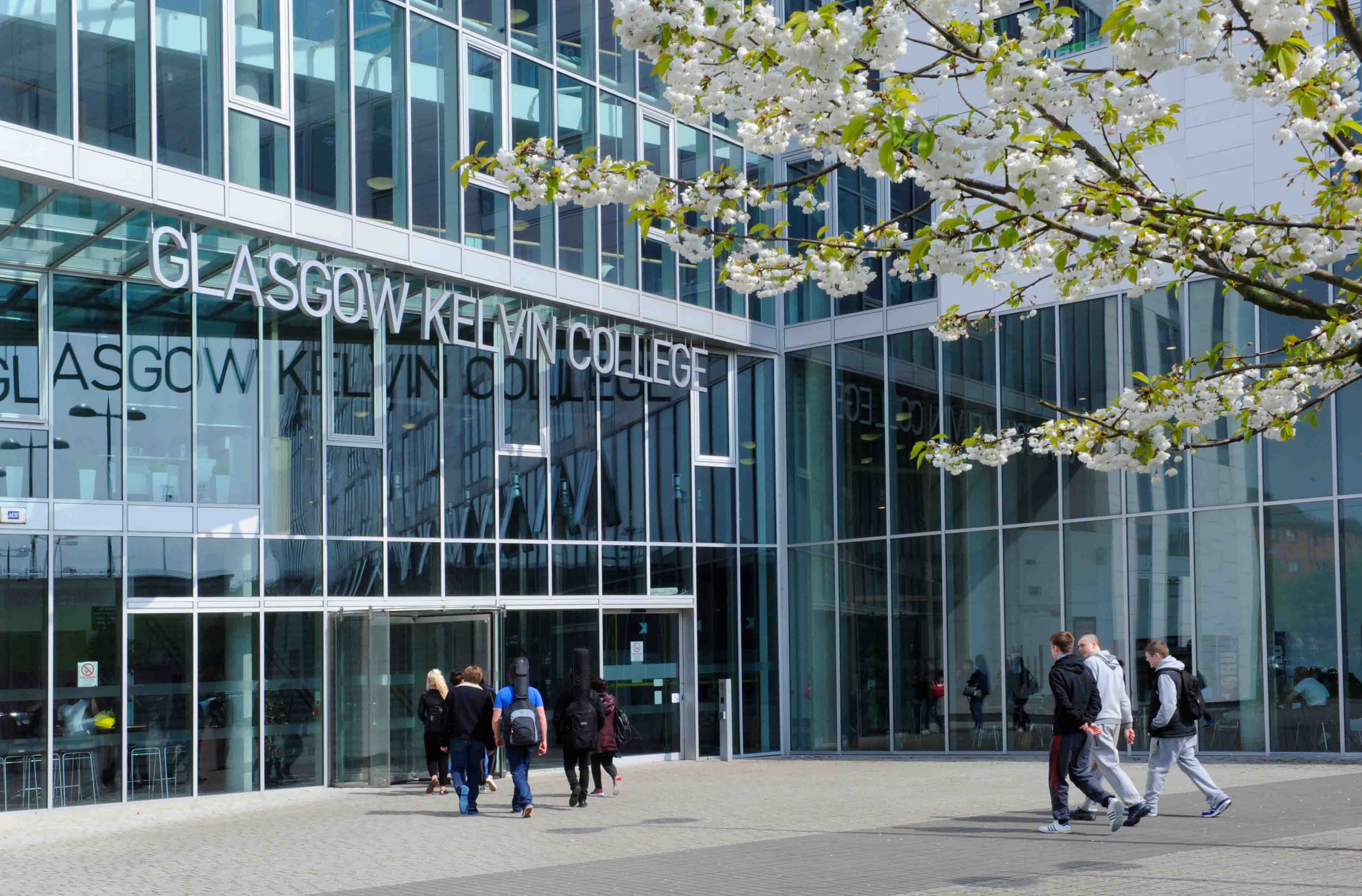 Front view of Glasgow Kelvin College Springburn Campus, featuring the main entrance, glass façade, and campus signage.