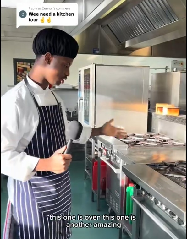 Hospitality student Mohammad giving a tour of the college training kitchen, demonstrating equipment during an interview.